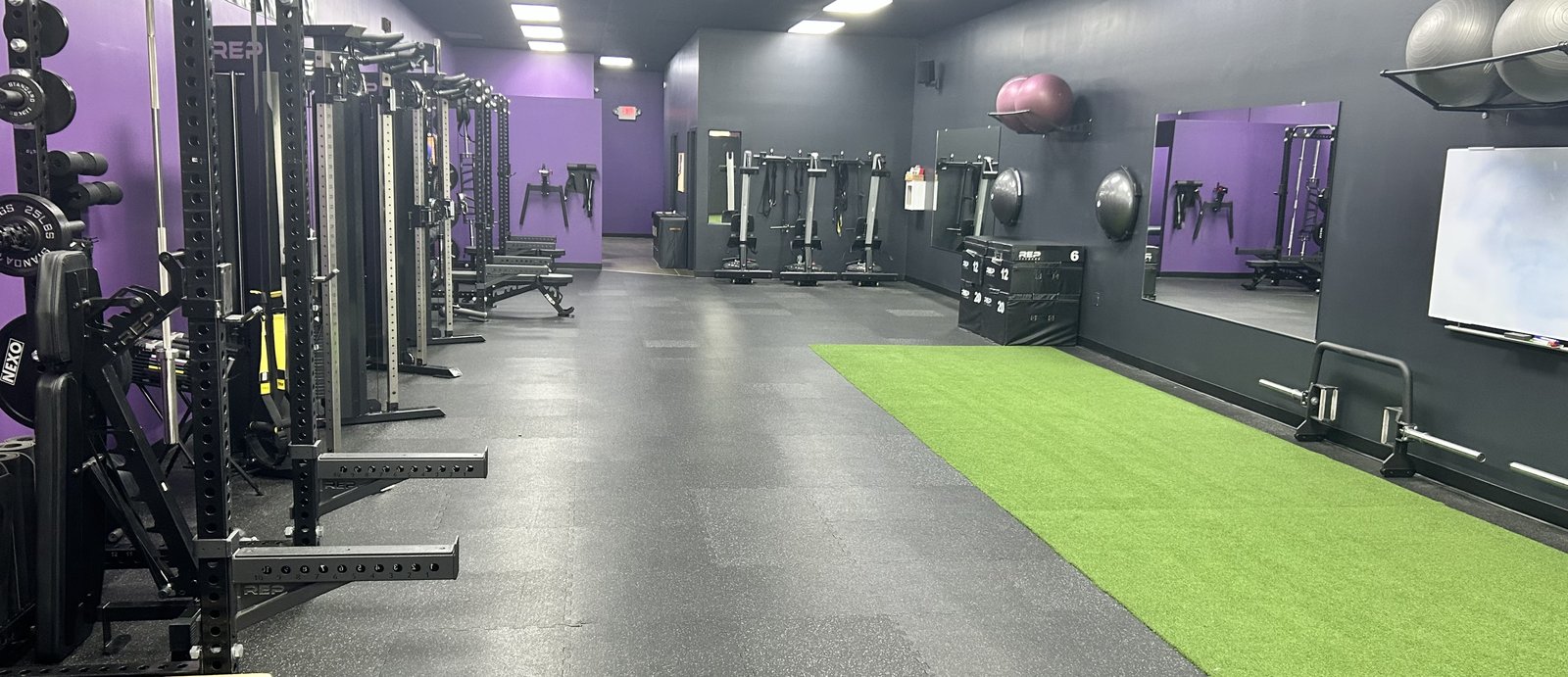North Naples training studio with strength equipment and an open turf area.